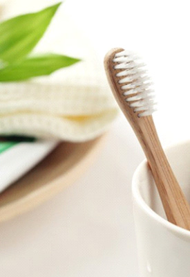Bamboo toothbrush in a cup